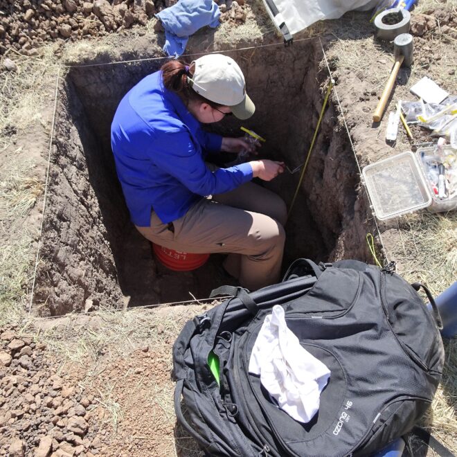 Dr. Christy Briles, from the University of Colorado, Denver, taking pollen samples from a test pit.